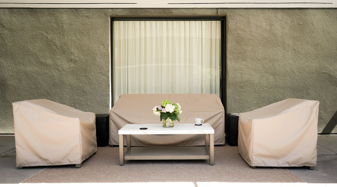 Patio furniture with patio furniture covers on them. 