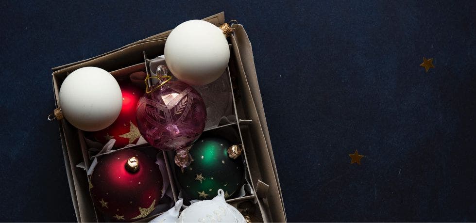 Christmas ornaments in a cardboard storage box