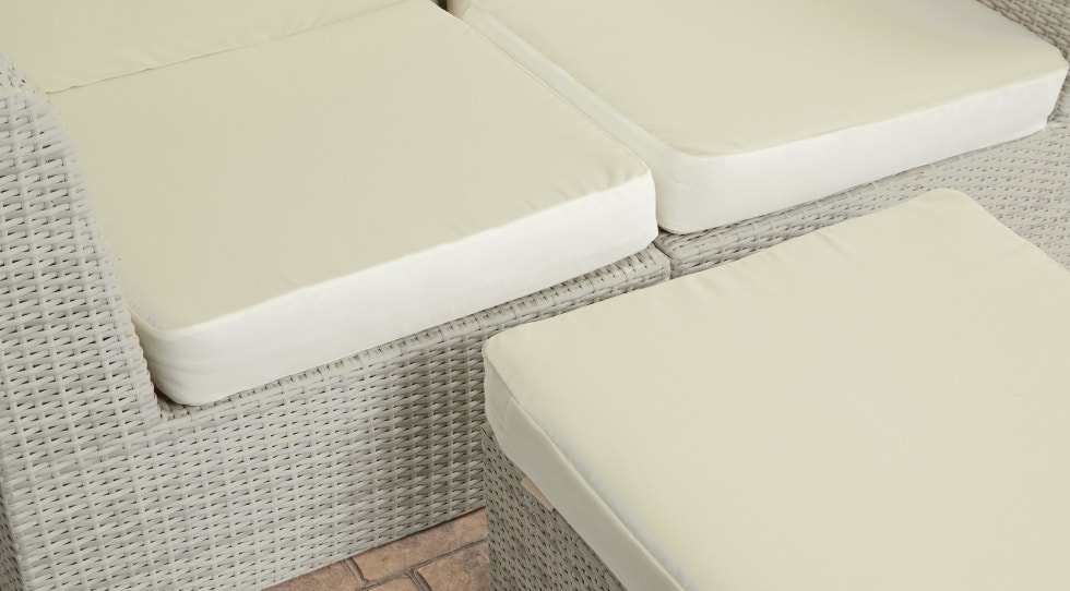 Pollen on white patio furniture cushions