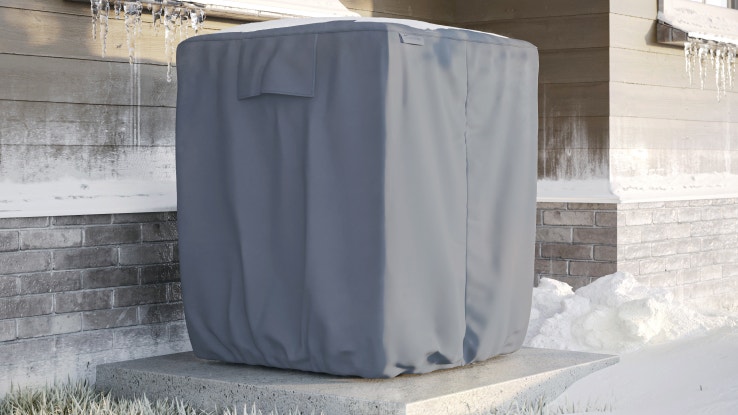 Outdoor air conditioner cover covered with snow