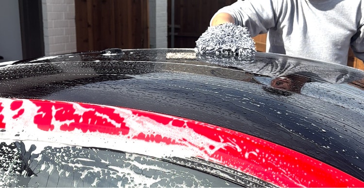 Start by washing the top of your car