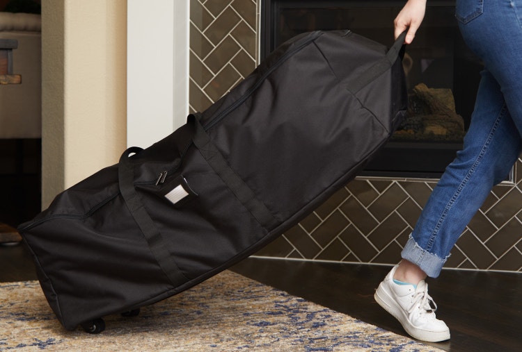 Person rolling a custom sized storage bag