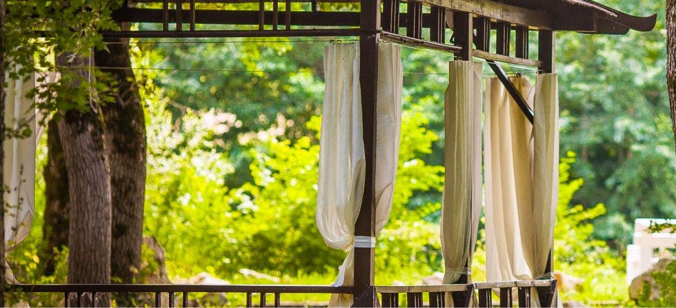 Outdoor curtains hung using wire