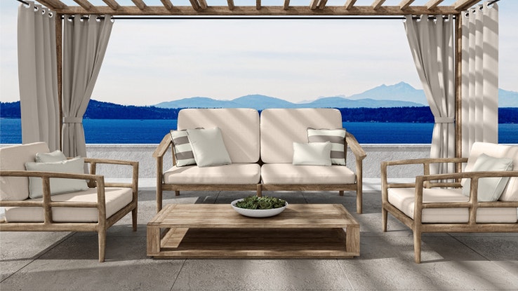 Outdoor patio with lounge chairs, a sofa, and outdoor curtains