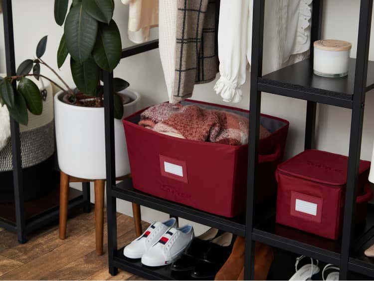 Closet storage bins with clothing inside