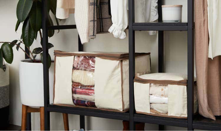 Canvas storage bags with blankets and sweaters inside