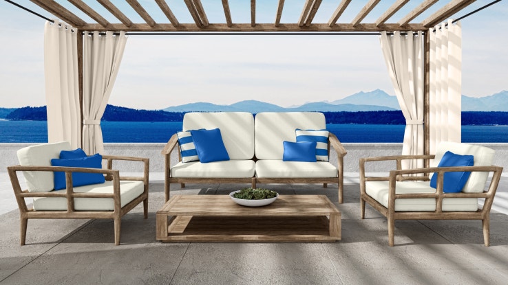 Outdoor patio with lounge chairs, a sofa, and outdoor curtains