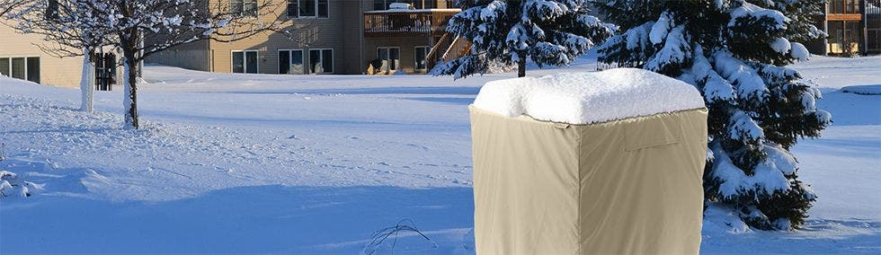 air conditioner cover with snow on top